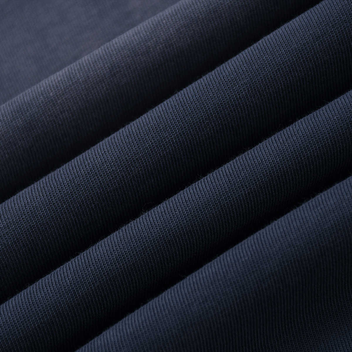 Close-up of dark blue fabric with a textured pattern